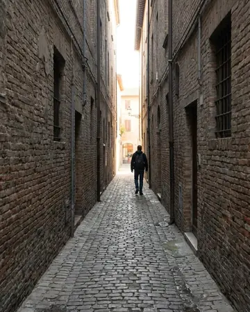 The alley says more in ink. Photographed without a preset.