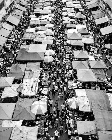 A busy market crowd from above, daylight. With the Mono Film preset applied.