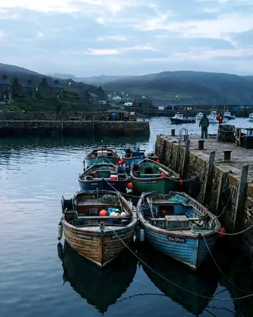 Morning boats, before the harbour woke. With the Roamhue preset applied.