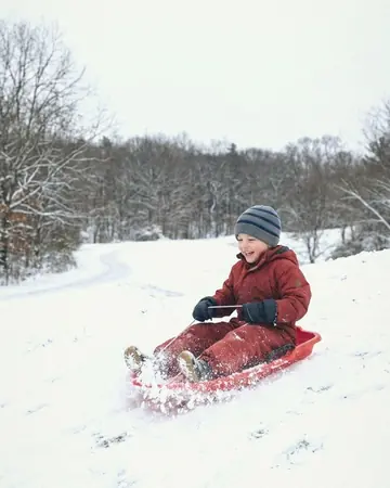 child sledding. With the True Skin preset applied.