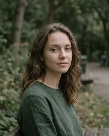 A fictional woman's portrait outdoors in open shade, daylight. Photographed without a preset.